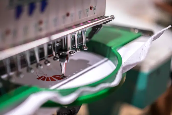 Industrial Tajima embroidery machine in Approval Stitch laboratory for stitch testing